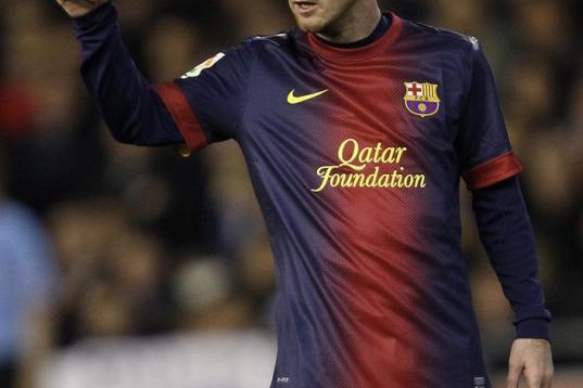 Barcelona's Lionel Messi from Argentina makes thumbs-up sign during their La Liga soccer match against Valencia at the Mestalla stadium in Valencia, Spain, Sunday, Feb. 3, 2013. (AP Photo/Alberto Saiz)