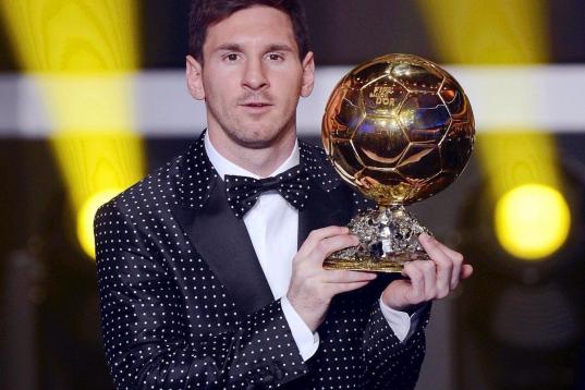 FC Barcelona's Argentinian striker Lionel Messi poses with the trophy after being awarded the FIFA Men's World Player of the Year during the FIFA Ballon d'Or Gala 2012 held at the Kongresshaus in Zurich, Switzerland, Monday, Jan 7, 2013. Messi w...