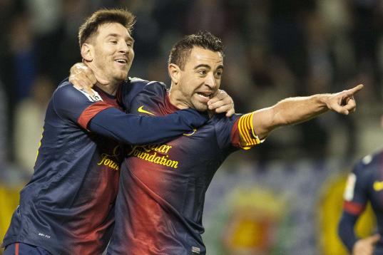 VALLADOLID, SPAIN - DECEMBER 22:  Xavi Hernandez of FC Barcelona celebrates with his teammate Lionel Messi after scoring against Real Valladolid during the La Liga game between Real Valladolid and FC Barcelona at Jose Zorrilla on December 22, 20...