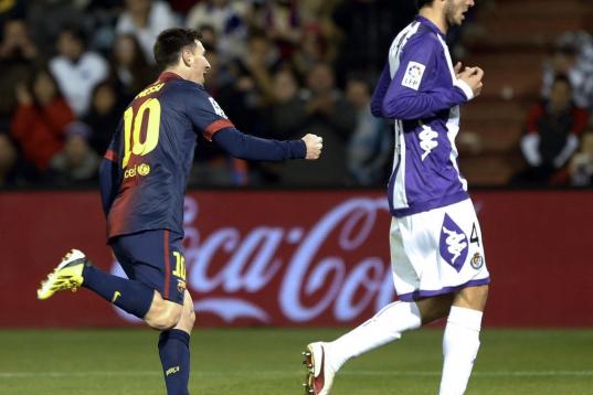 Barcelona's Argentinian forward Lionel Messi (L) celebrates after scoring during the Spanish league football match Real Valladolid vs FC Barcelona at the Jose Zorilla stadium in Valladolid on December 22, 2012. Barcelona won the match 3-1.  AFP ...
