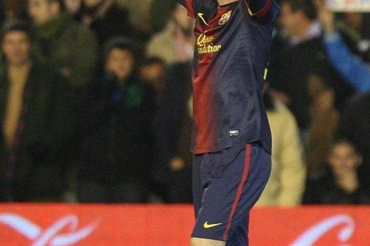 Barcelona's Leo Messi frm Argentina reacts after scoring against Betis during their La Liga soccer match at the Benito Villamarin stadium, in Seville, Spain, Sunday, Dec. 9, 2012. (AP Photo/Angel Fernandez)