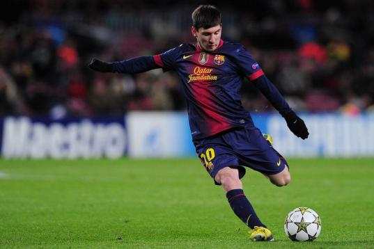 Barcelona's Argentinian forward Lionel Messi kicks the ball during the UEFA Champions League football match FC Barcelona vs SL Benfica at the Camp Nou stadium in Barcelona on December 5, 2012. AFP PHOTO  / LLUIS GENE        (Photo credit should ...