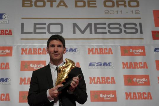 Barcelona's Argentinian forward Lionel Messi poses after receiving the European Golden Boot 2012 award for best European goalscorer of the 2011-2012 season, on October 29, 2012 in Barcelona. Messi scored a Spanish-league record of 50 goals for B...