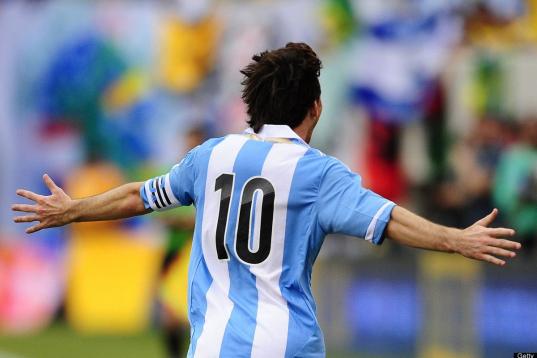 Argentinian soccer player Lionel Messi celebrates after scoring his third goal during a friendly match against Brazil at the MetLife Stadium in East Rutherford, New Jersey, on June 9, 2012. Argentina won 4-3.    AFP PHOTO/Mehdi Taamallah        ...
