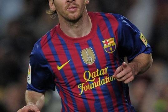 Barcelona's Argentinian forward Lionel Messi celebrates after scoring during the Spanish League football match Barcelona vs Malaga at the Camp Nou stadium in Barcelona on May 2, 2012. AFP PHOTO/ JOSEP LAGO        (Photo credit should read JOSEP ...