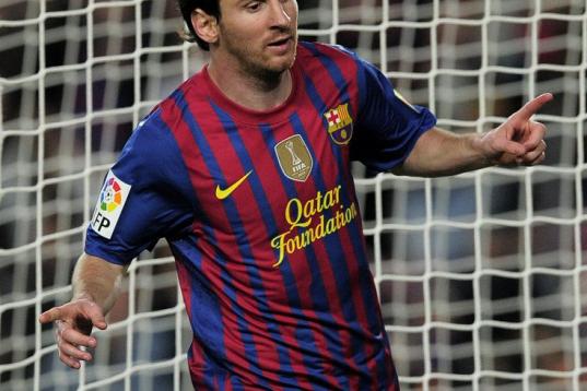 Barcelona's Argentinian forward Lionel Messi celebrates after scoring during the Spanish League football match Barcelona vs Malaga at the Camp Nou stadium in Barcelona on May 2, 2012. AFP PHOTO/ JOSEP LAGO        (Photo credit should read JOSEP ...