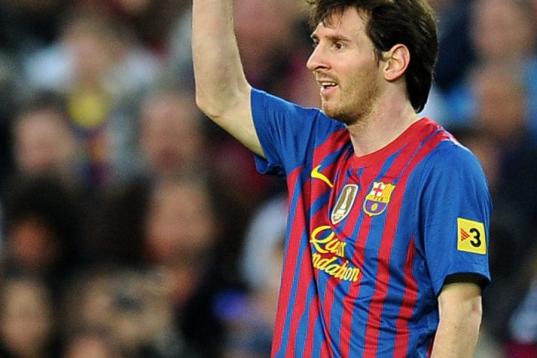Barcelona's Argentinian forward Lionel Messi gestures during the Spanish league football match FC Barcelona vs Malaga CF on May 2, 2012 at the Camp Nou stadium in Barcelona. AFP PHOTO/LLUIS GENE        (Photo credit should read LLUIS GENE/AFP/Ge...