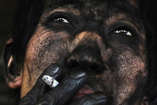 El rostro de un minero de carbón chino. 