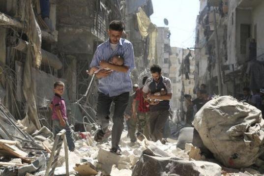 Rescued From the Rubble. Ameer Alhalbi, Syria, Agence France-Presse. 

