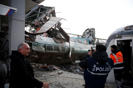 ANKARA, TURKEY - DECEMBER 13 :  Police officers inspect the scene at the station after high-speed train crashed in Turkish capital Ankara on December 13, 2018. (Photo by Dogukan Keskinkilic/Anadolu Agency/Getty Images)