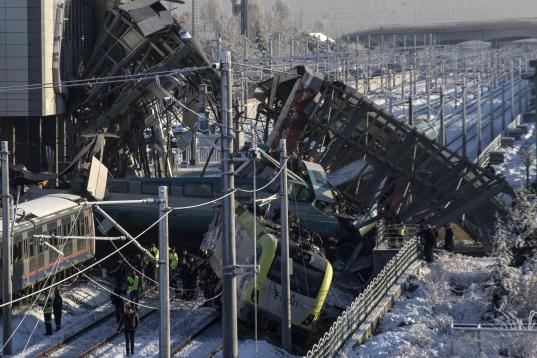 ANKARA, TURKEY - DECEMBER 13 : Crash site is seen after high-speed train crashed in Turkish capital Ankara on December 13, 2018. At least four people were killed and 43 injured when a high-speed train crashed into a pilot engine traveling along ...