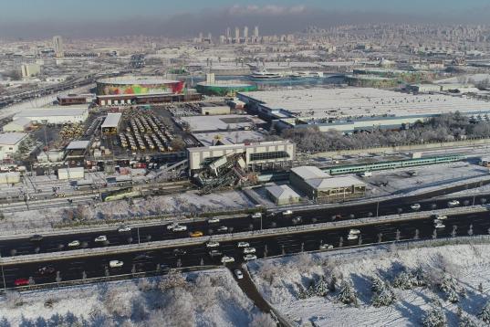 ANKARA, TURKEY - DECEMBER 13 : A drone photo shows aerial view of the crash site where a high-speed train crashed into a pilot engine traveling along the same rails in Turkish capital Ankara on December 13, 2018. After the crash an overpass also...