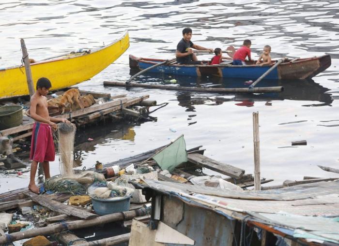 El tifón 'Bopha' deja al menos 238 muertos a su paso por Filipinas (FOTOS)