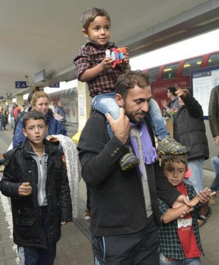Persecución, caminata, lluvia... y las primeras sonrisas de los refugiados (FOTOS)