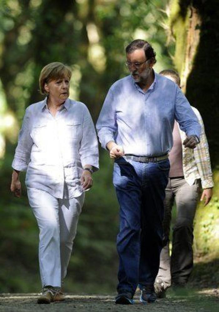 Merkel, recibida en Santiago con gritos de "vete para Alemania" y "menos recortes"