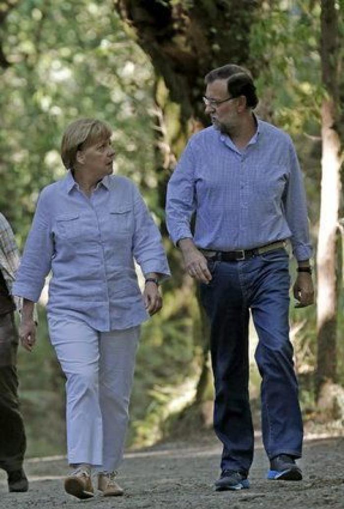 Merkel y Rajoy, de paseo por el Camino de Santiago