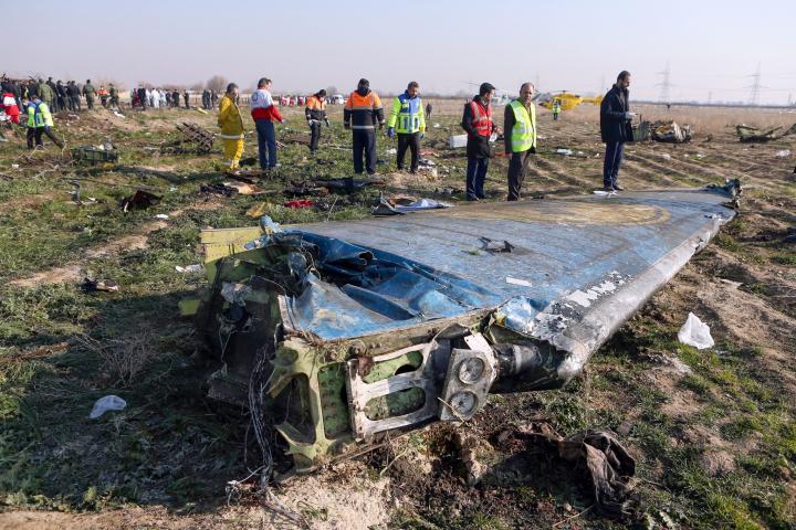 Rescue teams are seen on January 8, 2020 at the scene of a Ukrainian airliner that crashed shortly after take-off near Imam Khomeini airport in the Iranian capital Tehran. - Search-and-rescue teams were combing through the smoking wreckage of th...