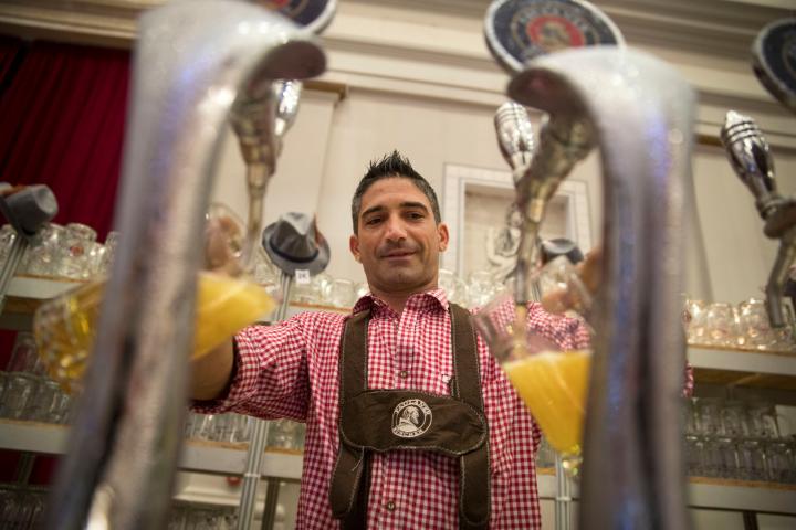 A waiter serves beers during the Oktoberfest beer festival in Palma de Mallorca on the Spanish Balearic Island of Mallorca on September 29, 2018. (Photo by JAIME REINA / AFP)        (Photo credit should read JAIME REINA/AFP/Getty Images)