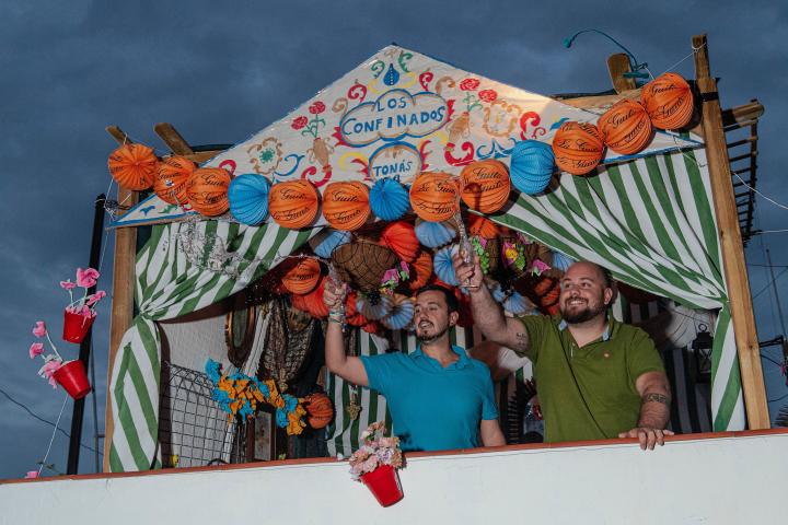 MAIRENA DEL ALCOR, SPAIN - APRIL 24: Manuel, 30, and Jesus, 27 drink a manzanilla in an homemade Caseta, little house, called 'Los Confinados' (the confined) in their terrace on April 24, 2020 in Mairena del Alcor, Spain. With restrictions in pl...