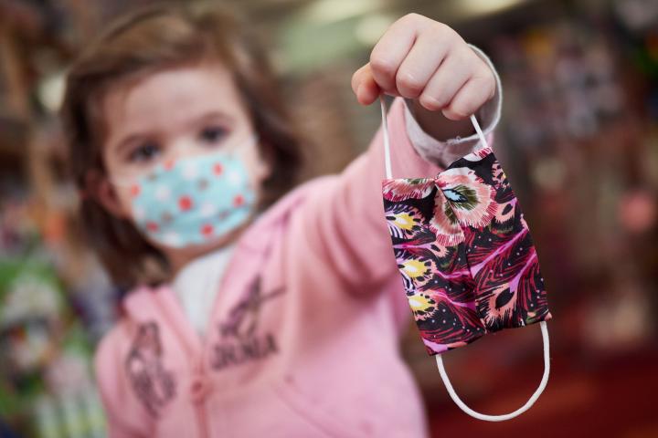 PAMPLONA, SPAIN - APRIL 26: The photographer's niece is seen showing a mask on the first day since March 15th that the children under 14 are allowed to go out, for an hour a day, accompanied by an adult and keeping the safety  distance  on April...