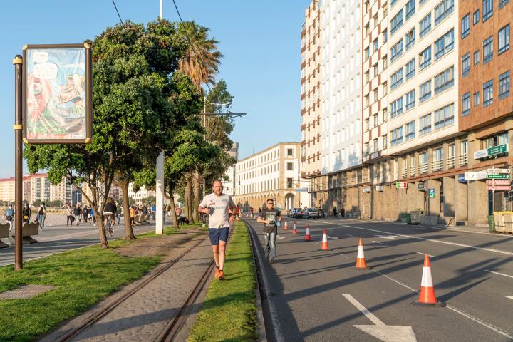 A CORUÑA, SPAIN - MAY 11: View of the lane enabled in Paseo de Riazor for people to walk and run during the hours allowed by the government for exercise, in phase one of COVID-19 on May 11, 2020 in A Coruña, Spain. Some parts of Spain have ent...