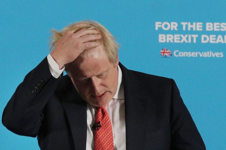Britain's Foreign Secretary, Boris Johnson, adjusts his hair as he makes a speech on the General Election campaign trail in Shildon, north eastern England, Tuesday June 6, 2017. Britain is holding parliamentary elections on Thursday, June 8. (Ow...