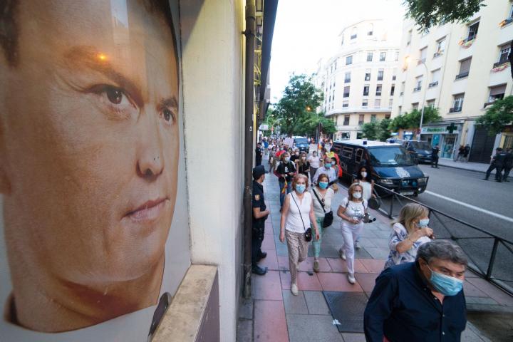 MADRID, SPAIN - MAY 21: People are seen with saucepans and Spanish flags on a concentration against the Government celebrated in front of the Socialist Party headquarters and an image of president of the Government, Pedro Sanchez, on May 22, 202...