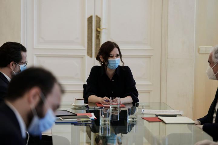 MADRID, SPAIN - MAY 05: (L-R) The President of the Community of Madrid, Isabel Diaz Ayuso, during a meeting with the counsellor of Economy, Employment and Competitiveness of the Community of Madrid, Manuel Gimenez, the counsellor of Finance and ...