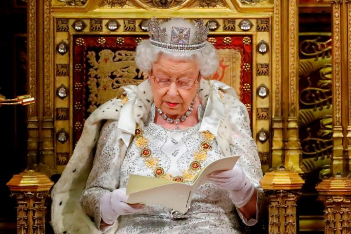 Britain's Queen Elizabeth II reads the Queen's Speech on the The Sovereign's Throne in the House of Lords during the State Opening of Parliament in the Houses of Parliament in London on October 14, 2019. - The State Opening of Parliament is wher...