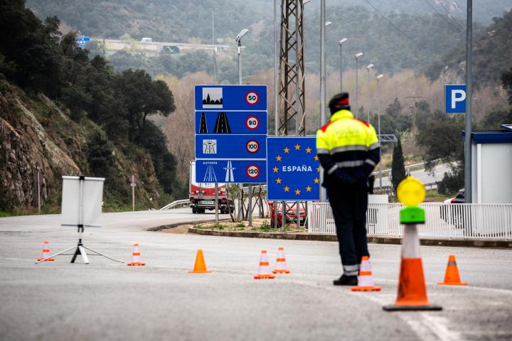 Spanish police forces at the checkpoint control entry and exit at the border with France in La Jonquera, Spain, on March 17, 2020. Today it's the first day of the closing of the borders between Spain and France. The police just let enter spanish...