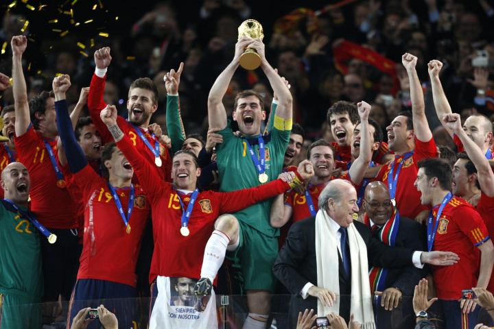 Spain captain and goalkeeper Iker Casillas lifts the world cup trophy and celebrates with teammates   (Photo by Mike Egerton - PA Images via Getty Images)
