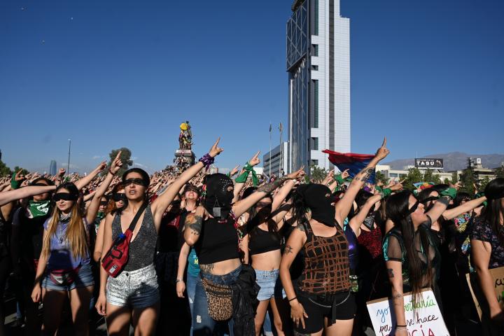 Feminist activists take part in a choreographed performance against gender violence and patriarchy in Santiago on November 29, 2019. - Furious Chileans have since October 18 been protesting social and economic inequality, and against an entrench...