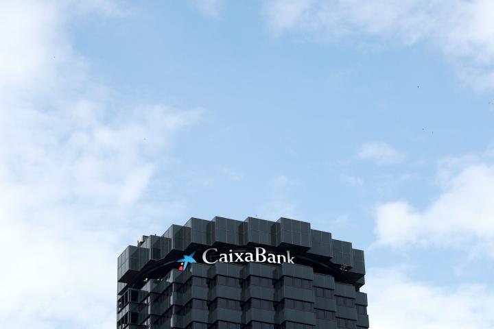 CaixaBank's logo is seen on top of the company's headquarters in Barcelona, Spain, September 17, 2020. REUTERS/Albert Gea