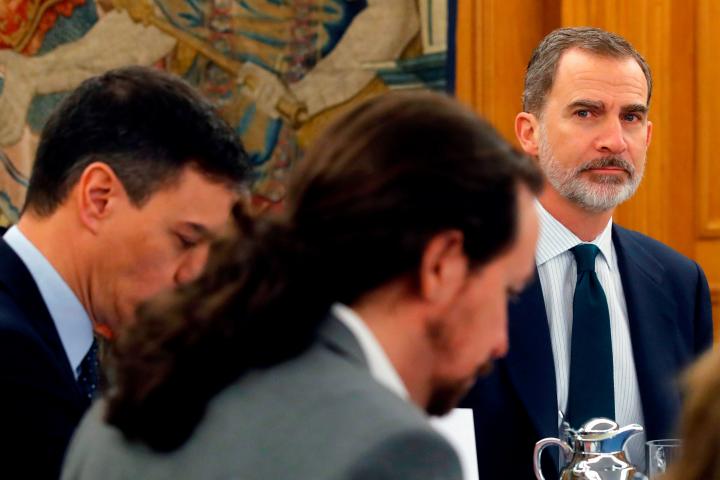 King Felipe VI of Spain (R) presides a Cabinet Meeting held at the Zarzuela Palace in Madrid, on February 18, 2020 next to Spain's Prime Minister Pedro Sanchez and Spain's Deputy Prime Minister for Social Rights and Sustainable Development Pablo...