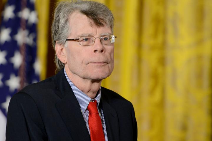 WASHINGTON, DC - SEPTEMBER 10:  President Barack Obama presents author Stephen King with the 2014 National Medal of Arts at The White House on September 10, 2015 in Washington, DC.  (Photo by Leigh Vogel/WireImage)
