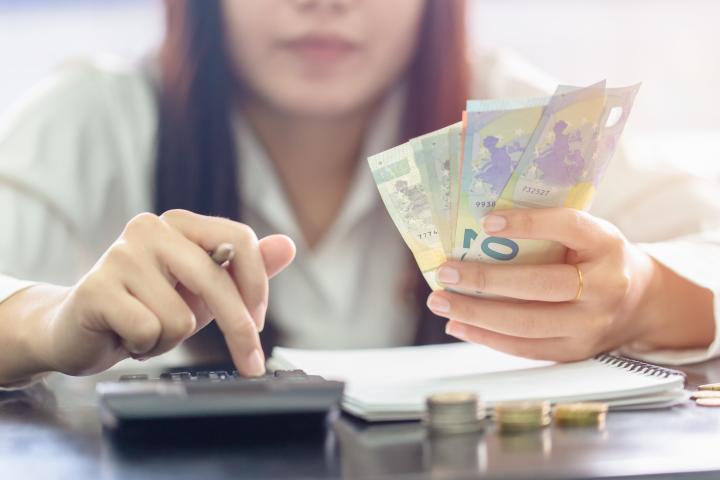 Woman counting money Euro banknotes, Business or stock market concept image.