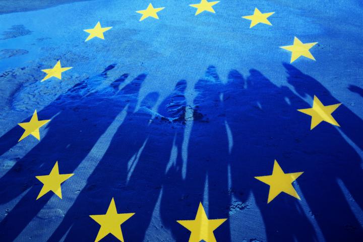 Flag of European Union with silhouette of people