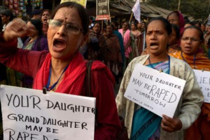 Leftist women activists carry posters as they shout slogans during a protest march against the gangrape and murder of a teenager, in Kolkata on January 3, 2014.  An Indian teenager near the eastern city of Kolkata has been gangraped twice and th...