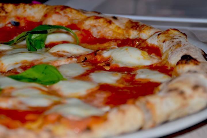 PIZZERIA, GIUGLIANO IN CAMPANIA, ITALY - 2016/05/18: Pizza Margherita first fried and then heated in the oven. Pizza is one of the most famous Italian dishes. It finds its best expression in Naples. (Photo by Maria Consiglia Izzo/Pacific Press/L...