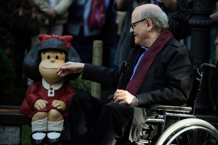 Cartoonist Joaquin Salvador Lavado, also known as Quino, touches a sculpture of his comic character Mafalda during an opening ceremony of a park of San Francisco in Oviedo, northern Spain, October 23, 2014. Quino will be awarded with the 2014 Pr...