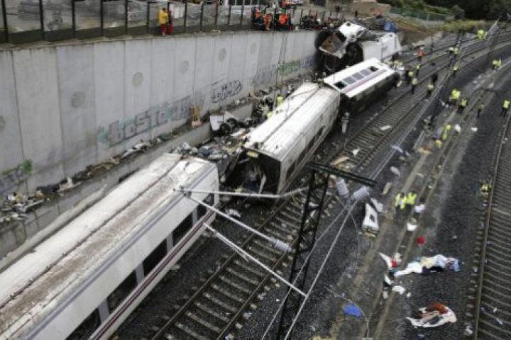 Rescuers, forensics and police officers work at the site of a train accident near the city of Santiago de Compostela on July 25, 2013. A train hurtled off the tracks on July 24, 2013 in northwest Spain killing at least 77 passengers and injuring...