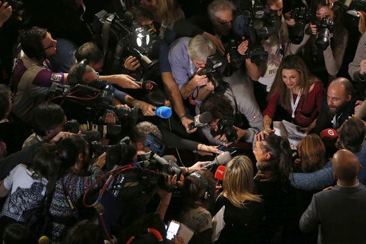 The media surround a lady who believed that she had won the fourth prize.